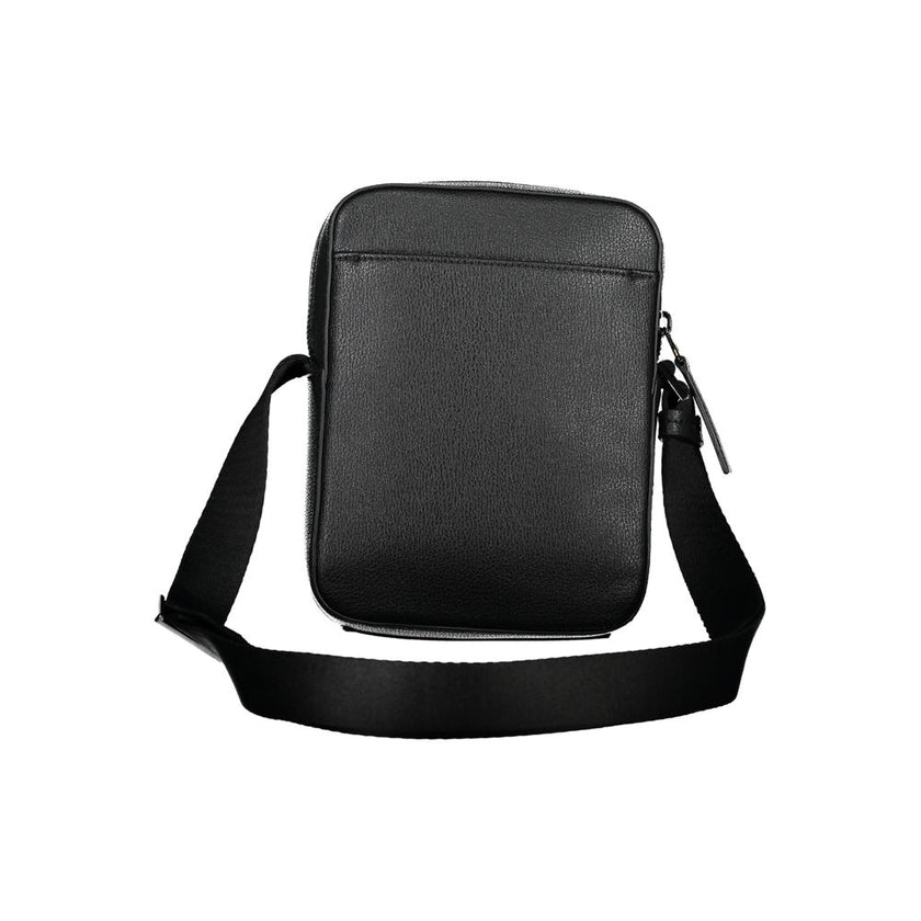 Sleek Black Shoulder Bag with Logo DetailExperience the perfect blend of functionality and style with this sleek black shoulder bag from the renowned Calvin Klein. Designed for the modern individual, it boasts an adjustable shoulder strap for customized c