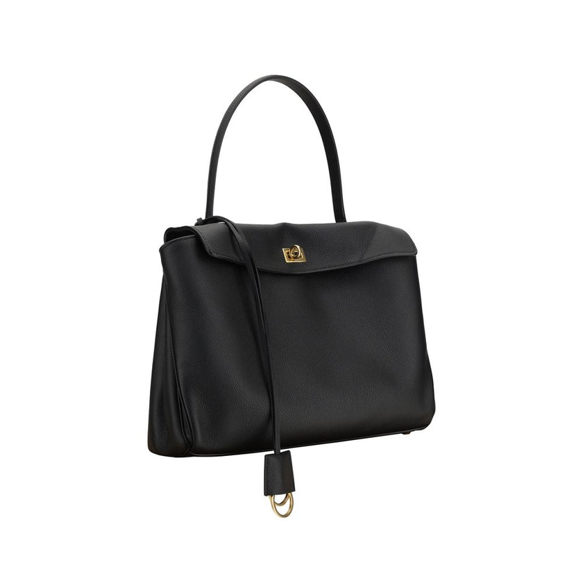 Black Calf Leather Bos Taurus Shoulder BagBalenciaga’s Rodeo Leather Shoulder Bag features a top handle for a comfortable and stylish grip. The front closure features a flap and swivel, adding a distinctive and functional detail. Applied keychain detail o