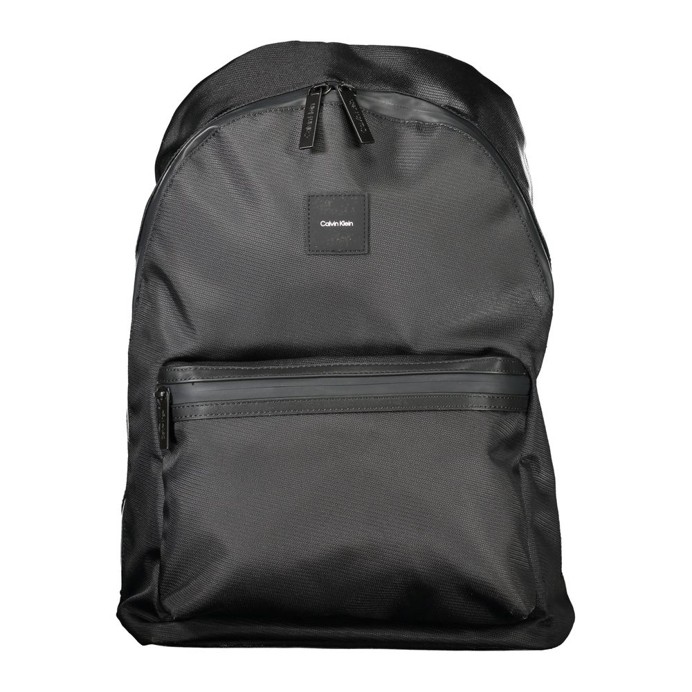 Black Polyester Men BackpackElevate your on-the-go gear with the Calvin Klein Backpack, designed to blend high fashion with practicality. A sleek black palette defines this accessory, underscored by an unmistakable logo, making it a stand-out piece. Craft