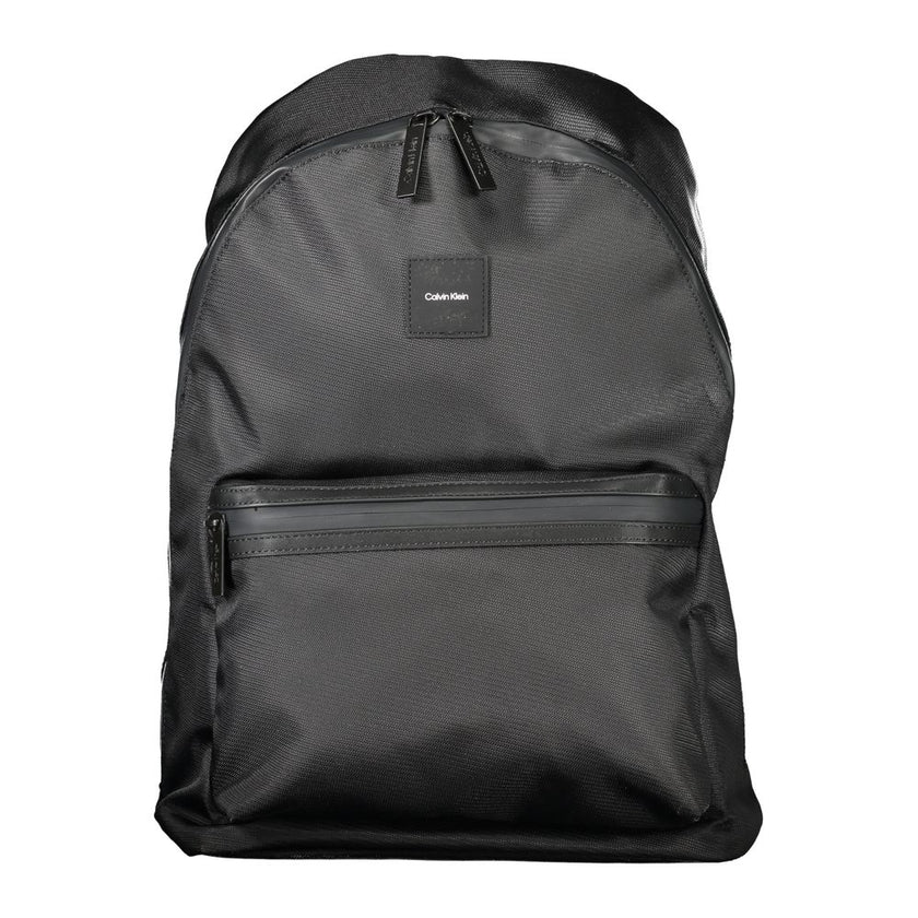 Black Polyester Men BackpackElevate your on-the-go gear with the Calvin Klein Backpack, designed to blend high fashion with practicality. A sleek black palette defines this accessory, underscored by an unmistakable logo, making it a stand-out piece. Craft