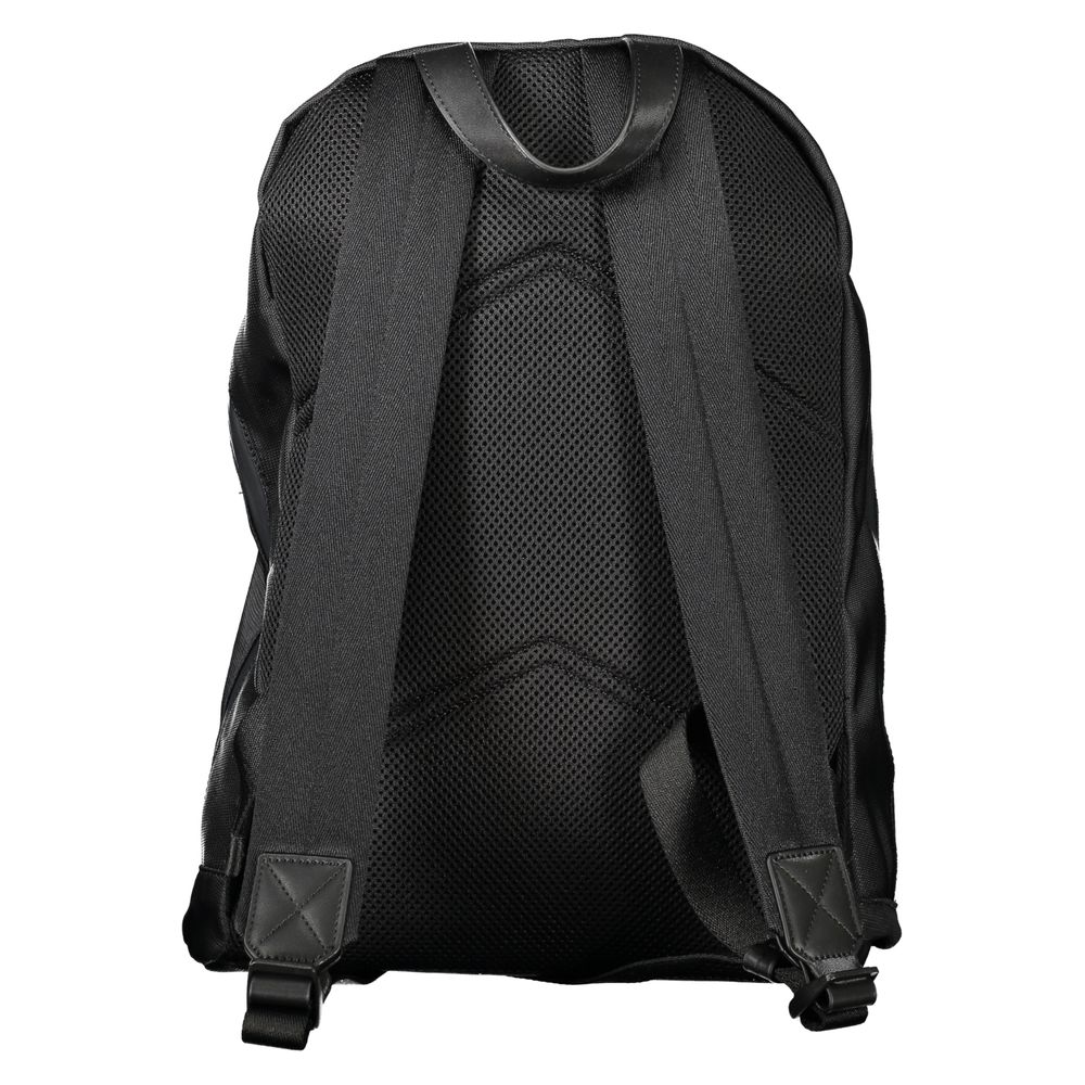 Black Polyester Men BackpackElevate your on-the-go gear with the Calvin Klein Backpack, designed to blend high fashion with practicality. A sleek black palette defines this accessory, underscored by an unmistakable logo, making it a stand-out piece. Craft