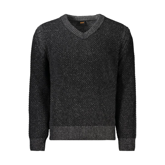 Black Wool Men SweaterElevate your wardrobe with the signature sophistication of Hugo Boss. This sleek long sleeve sweater features a classic V-neck cut, enhanced with eye-catching contrast details. The iconic logo subtly adorns the design, making it a pe