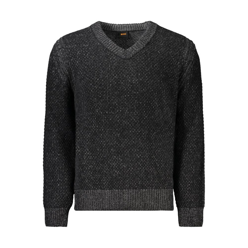 Black Wool Men SweaterElevate your wardrobe with the signature sophistication of Hugo Boss. This sleek long sleeve sweater features a classic V-neck cut, enhanced with eye-catching contrast details. The iconic logo subtly adorns the design, making it a pe