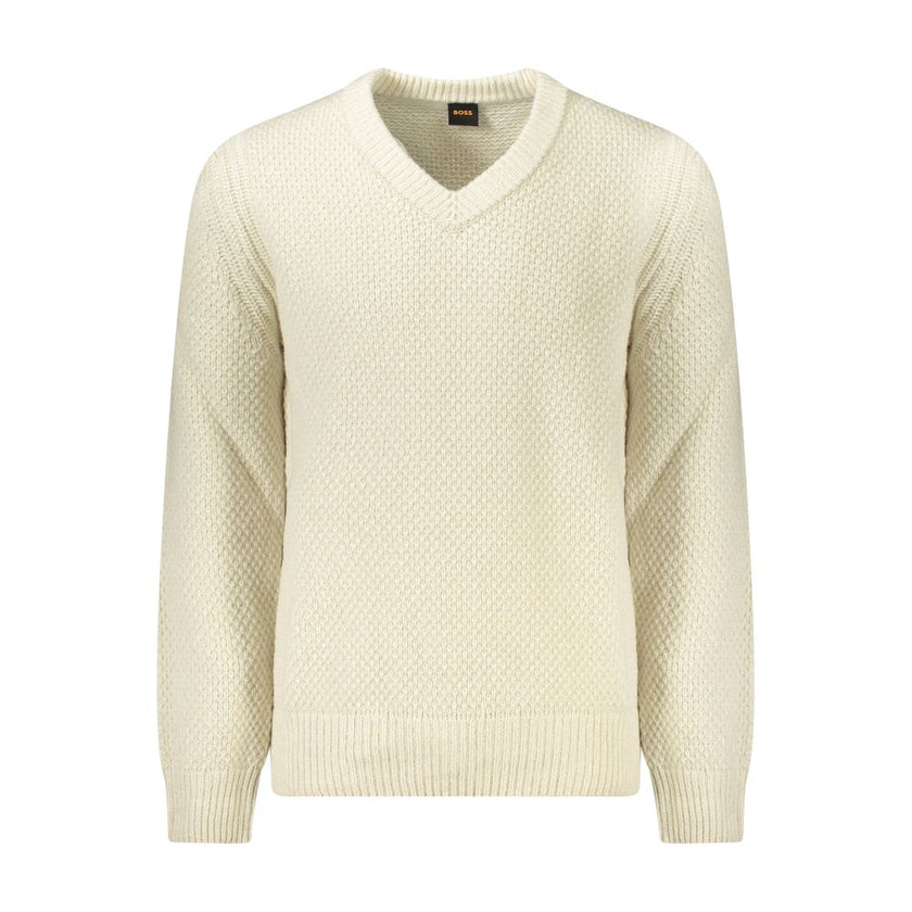 Beige Wool Men SweaterSet the tone of your day with the unmistakable sophistication of Hugo Boss. This long sleeve sweater features a classic V-neck cut, elegantly highlighted by contrasting details that pronounce a modern edge. The iconic Hugo Boss logo