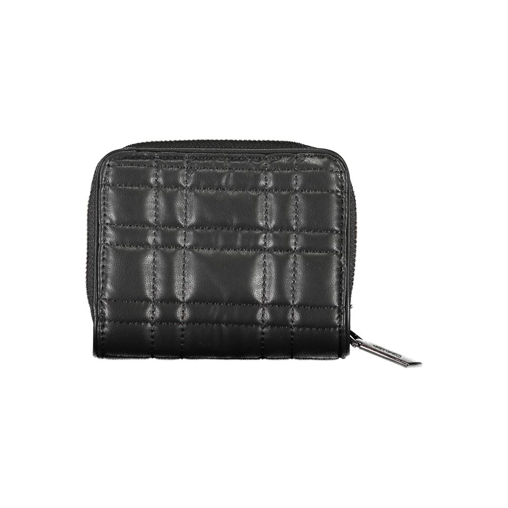Black Polyester Women WalletExperience the epitome of sophisticated storage with this Calvin Klein wallet, a sleek accessory designed for the modern trendsetter. Its compact yet cleverly organized interior boasts a single compartment for your essentials,