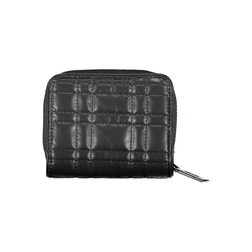 Black Polyester Women WalletExperience the epitome of sophisticated storage with this Calvin Klein wallet, a sleek accessory designed for the modern trendsetter. Its compact yet cleverly organized interior boasts a single compartment for your essentials,