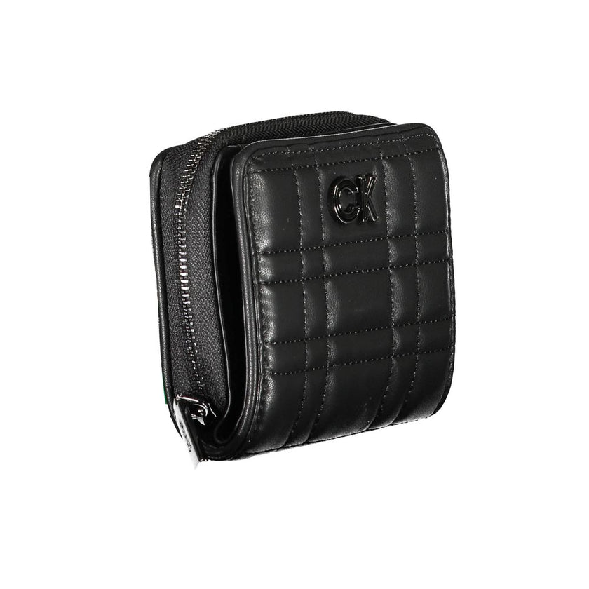 Black Polyester Women WalletExperience the epitome of sophisticated storage with this Calvin Klein wallet, a sleek accessory designed for the modern trendsetter. Its compact yet cleverly organized interior boasts a single compartment for your essentials,