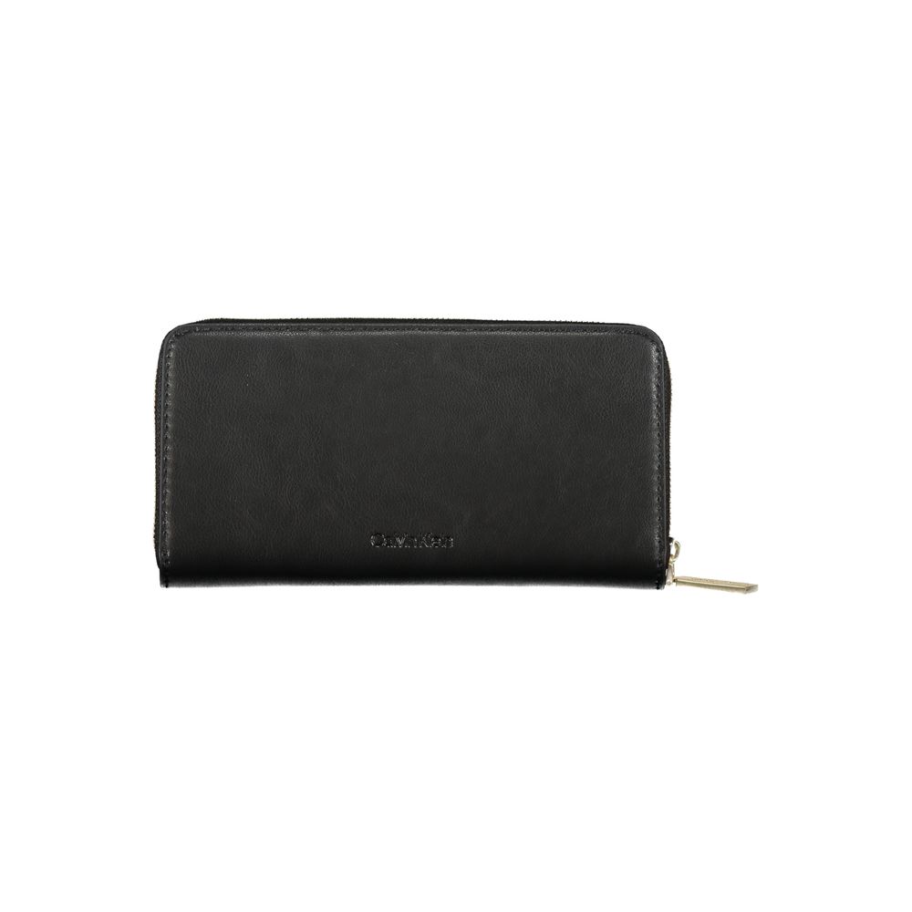 Elegant Multi-Compartment Designer WalletExperience the blend of functionality and sleek design with this sophisticated wallet from Calvin Klein. Designed for the modern individual, it offers five compartments, a convenient coin purse, and dedicated card