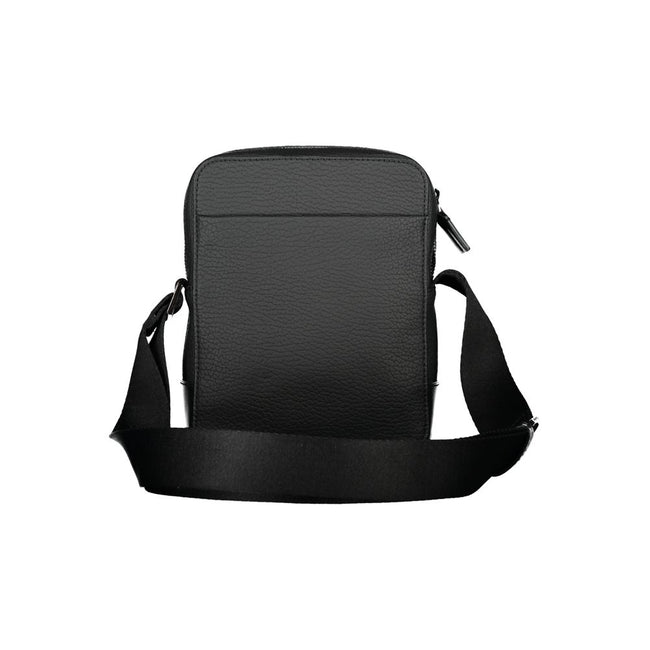 Sleek Black Shoulder Bag with Contrasting DetailsStep out in style with this sleek Calvin Klein shoulder bag, designed for the modern man. This bag boasts a practical adjustable strap for comfort, an external pocket for quick access, and a secure internal