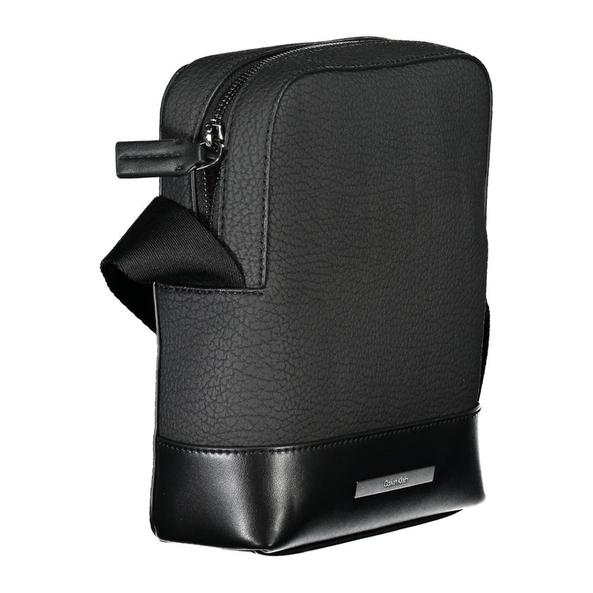 Sleek Black Shoulder Bag with Contrasting DetailsStep out in style with this sleek Calvin Klein shoulder bag, designed for the modern man. This bag boasts a practical adjustable strap for comfort, an external pocket for quick access, and a secure internal