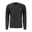 Black Cotton Men SweaterWrap yourself in the epitome of sleek elegance with this Hugo Boss long-sleeved sweater. Designed with a crew neck and eye-catching contrasting details, this piece is not just a garment—it’s a statement. The subtle application of t