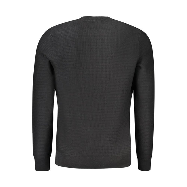 Black Cotton Men SweaterWrap yourself in the epitome of sleek elegance with this Hugo Boss long-sleeved sweater. Designed with a crew neck and eye-catching contrasting details, this piece is not just a garment—it’s a statement. The subtle application of t