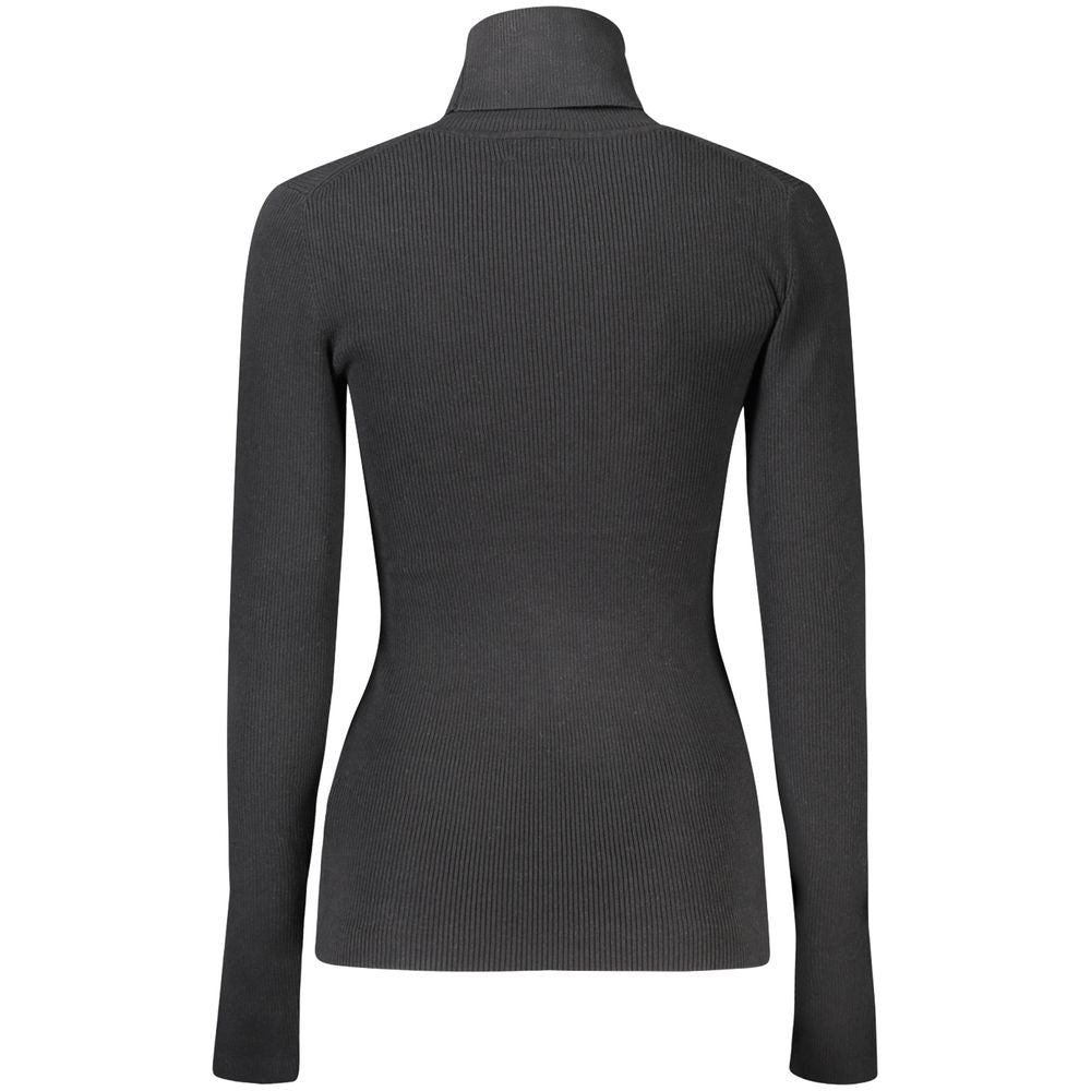 Black Cotton Women SweaterElevate your sweater game with Calvin Klein’s sleek turtleneck – an embodiment of modern sophistication. Tailored from a superior blend that prioritizes both comfort and form, this black sweater is a testament to understated luxu
