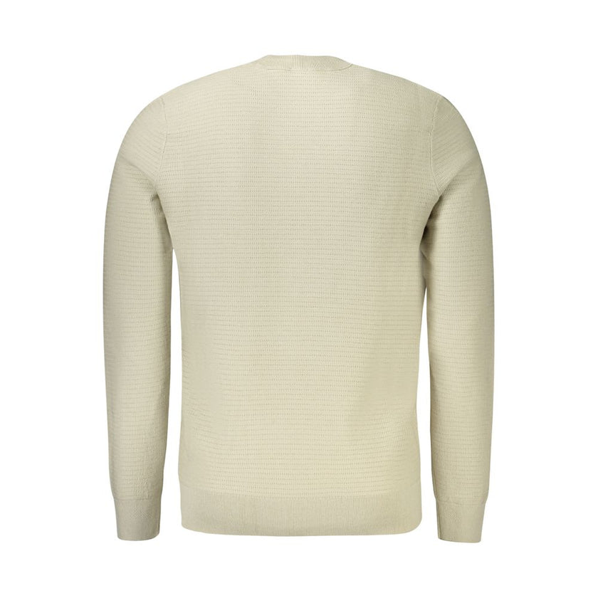 Beige Cotton Men SweaterElevate your wardrobe with the Hugo Boss sweater, a piece synonymous with effortless sophistication. This crew neck sweater, crafted with a luxurious blend of 95% cotton and 5% cashmere, ensures both comfort and style. Its long sle