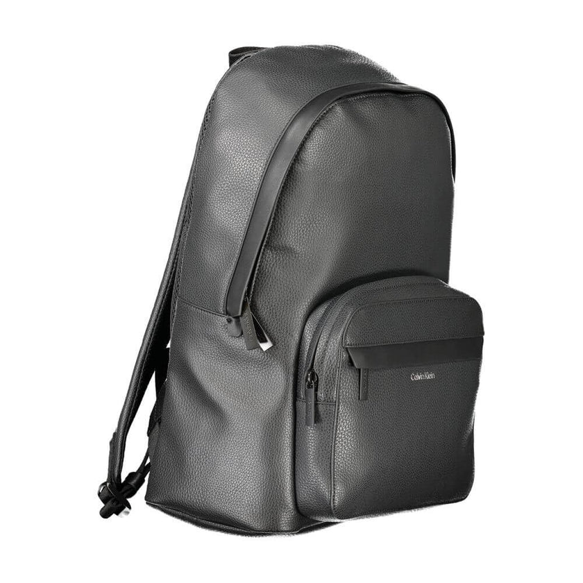 Black Polyester Men BackpackElevate your style with the sleek Calvin Klein backpack, designed for the modern trailblazer. A harmonious blend of functionality and minimalist luxury, this backpack features a chic black exterior with contrasting details that