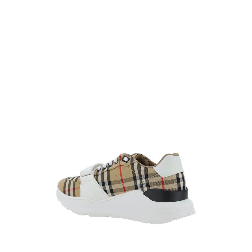 Beige Rubber SneakersNew Regis Sneakers by Burberry, slightly elongated toe, lace-up front closure, Velcro strap detail on front, iconic all-over repeated Check Archive brand pattern, contrasting brand signature on back. Season: AW25 Composition: SOLE 100