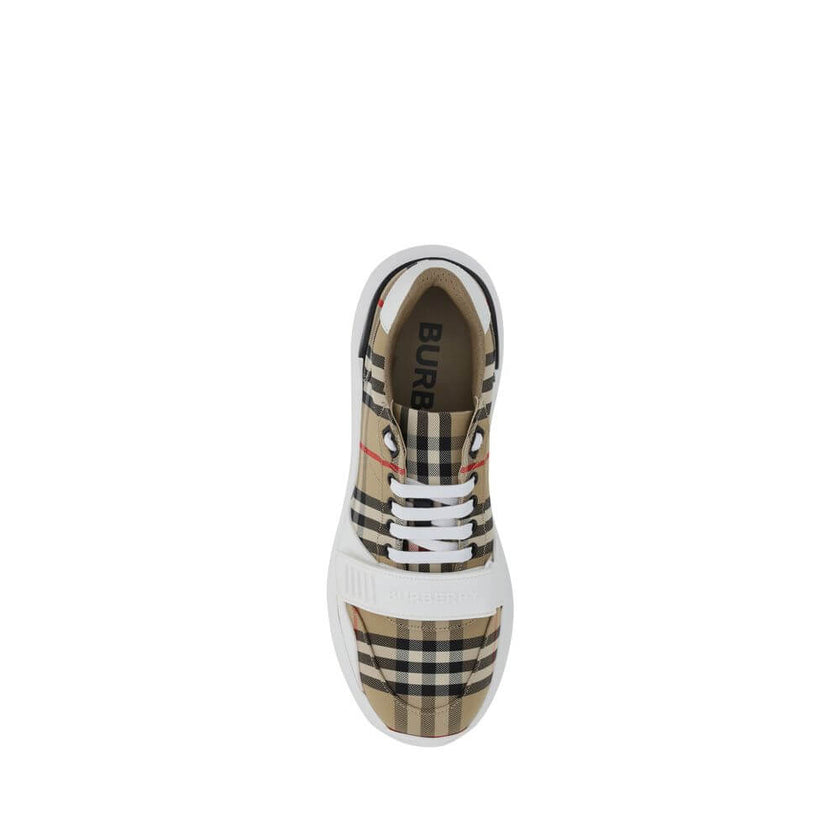 Beige Rubber SneakersNew Regis Sneakers by Burberry, slightly elongated toe, lace-up front closure, Velcro strap detail on front, iconic all-over repeated Check Archive brand pattern, contrasting brand signature on back. Season: AW25 Composition: SOLE 100