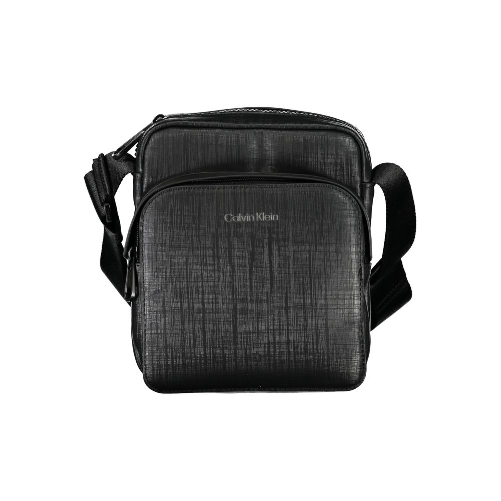Elegant Black Shoulder Bag with Contrasting DetailsExude sophistication with this sleek Calvin Klein shoulder bag, perfect for the modern man on-the-go. Featuring an adjustable shoulder strap for comfort, an external pocket for quick access essentials, an