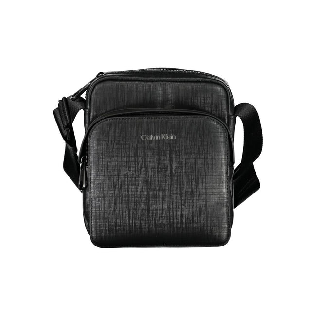 Elegant Black Shoulder Bag with Contrasting DetailsExude sophistication with this sleek Calvin Klein shoulder bag, perfect for the modern man on-the-go. Featuring an adjustable shoulder strap for comfort, an external pocket for quick access essentials, an