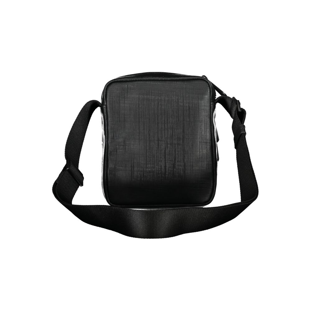 Elegant Black Shoulder Bag with Contrasting DetailsExude sophistication with this sleek Calvin Klein shoulder bag, perfect for the modern man on-the-go. Featuring an adjustable shoulder strap for comfort, an external pocket for quick access essentials, an