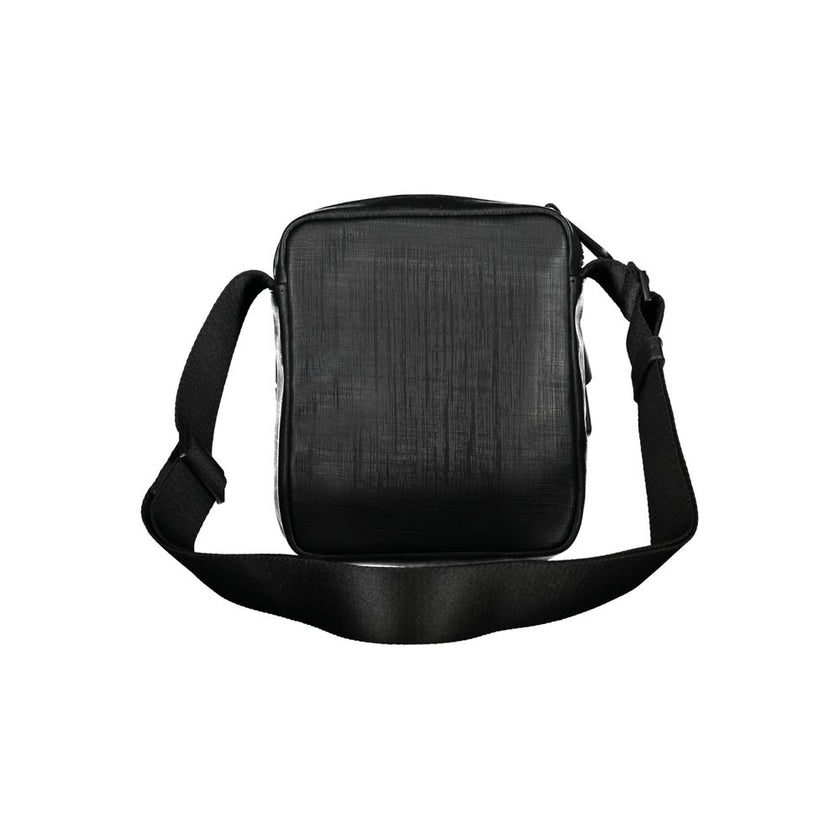 Elegant Black Shoulder Bag with Contrasting DetailsExude sophistication with this sleek Calvin Klein shoulder bag, perfect for the modern man on-the-go. Featuring an adjustable shoulder strap for comfort, an external pocket for quick access essentials, an