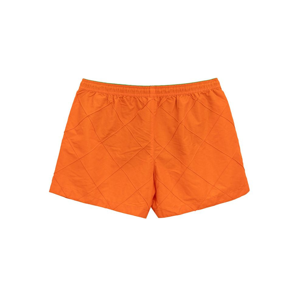 Orange Polyamide Swim ShortBottega Veneta Orange Weave Swim Trunks. Orange nylon boxer shorts with iconic weave pattern, elastic waistband with adjustable drawstring, two side pockets, internal mesh. Composition: 100% Polyamide Internal SKU: 25MAR101 Bran