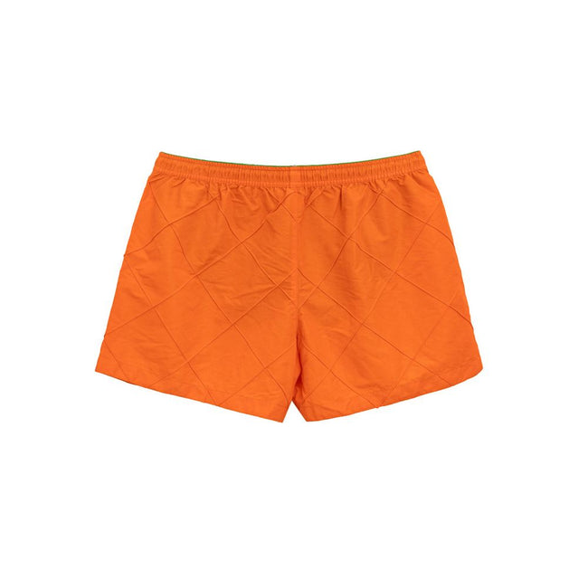 Orange Polyamide Swim ShortBottega Veneta Orange Weave Swim Trunks. Orange nylon boxer shorts with iconic weave pattern, elastic waistband with adjustable drawstring, two side pockets, internal mesh. Composition: 100% Polyamide Internal SKU: 25MAR101 Bran