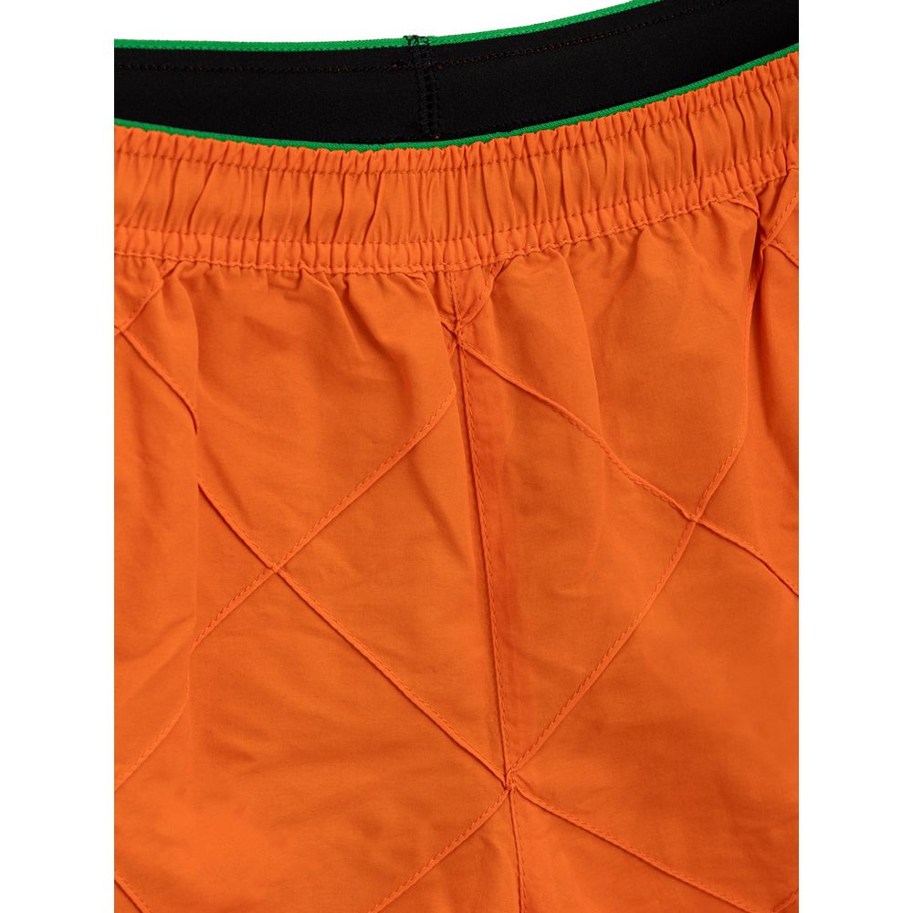 Orange Polyamide Swim ShortBottega Veneta Orange Weave Swim Trunks. Orange nylon boxer shorts with iconic weave pattern, elastic waistband with adjustable drawstring, two side pockets, internal mesh. Composition: 100% Polyamide Internal SKU: 25MAR101 Bran