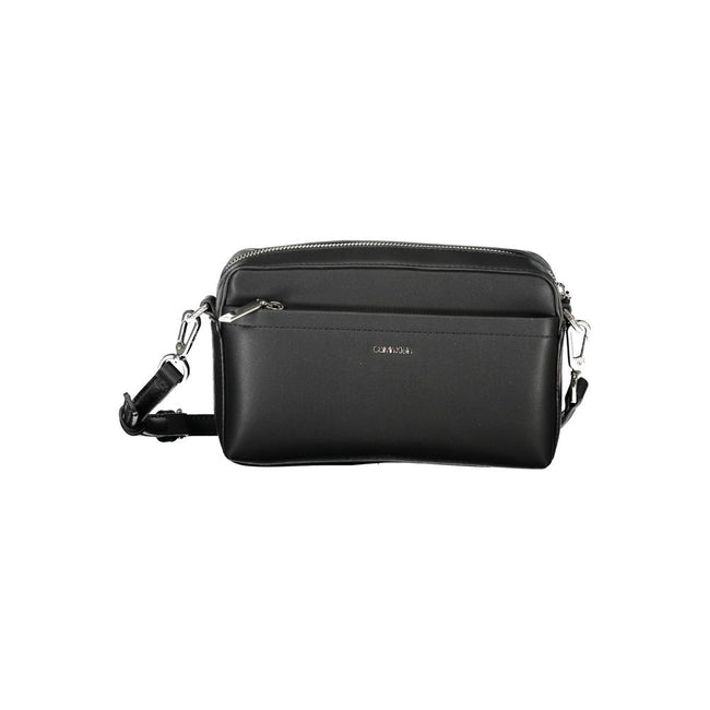 Black Polyester Women HandbagExperience the epitome of urban chic with Calvin Klein’s latest handbag creation. Designed for the modern fashionista, this sleek black bag boasts functionality and style. Featuring one removable shoulder handle and an adjusta
