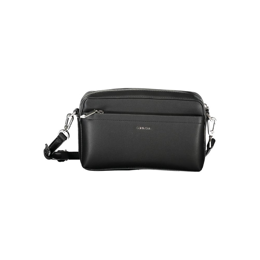 Black Polyester Women HandbagExperience the epitome of urban chic with Calvin Klein’s latest handbag creation. Designed for the modern fashionista, this sleek black bag boasts functionality and style. Featuring one removable shoulder handle and an adjusta