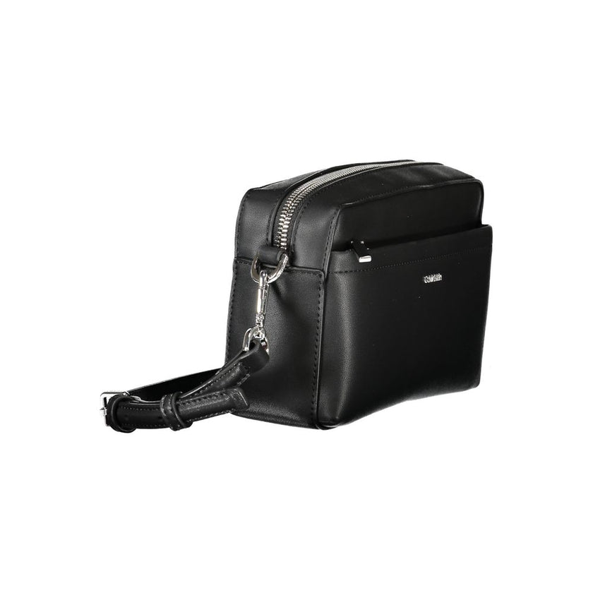 Black Polyester Women HandbagExperience the epitome of urban chic with Calvin Klein’s latest handbag creation. Designed for the modern fashionista, this sleek black bag boasts functionality and style. Featuring one removable shoulder handle and an adjusta