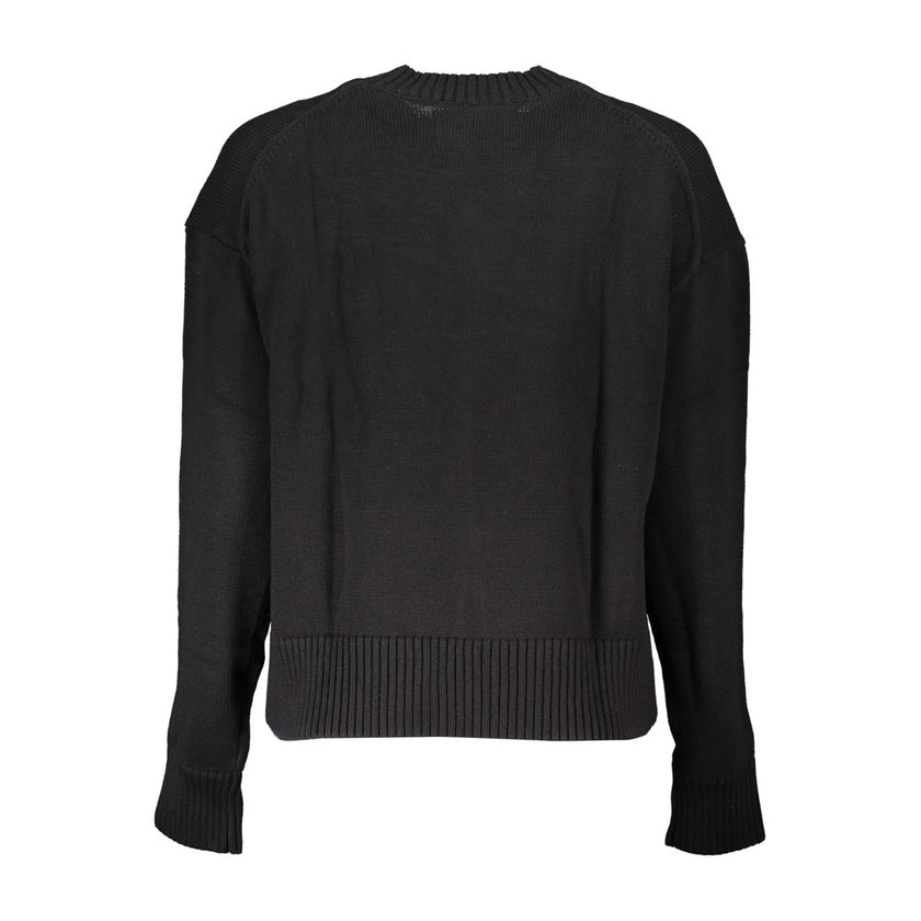 Elegant Long Sleeve Crew Neck SweaterElevate your wardrobe with this sophisticated long-sleeved sweater from Calvin Klein, designed for the modern woman seeking both comfort and style. Crafted from high-quality cotton, this chic piece features a classic c
