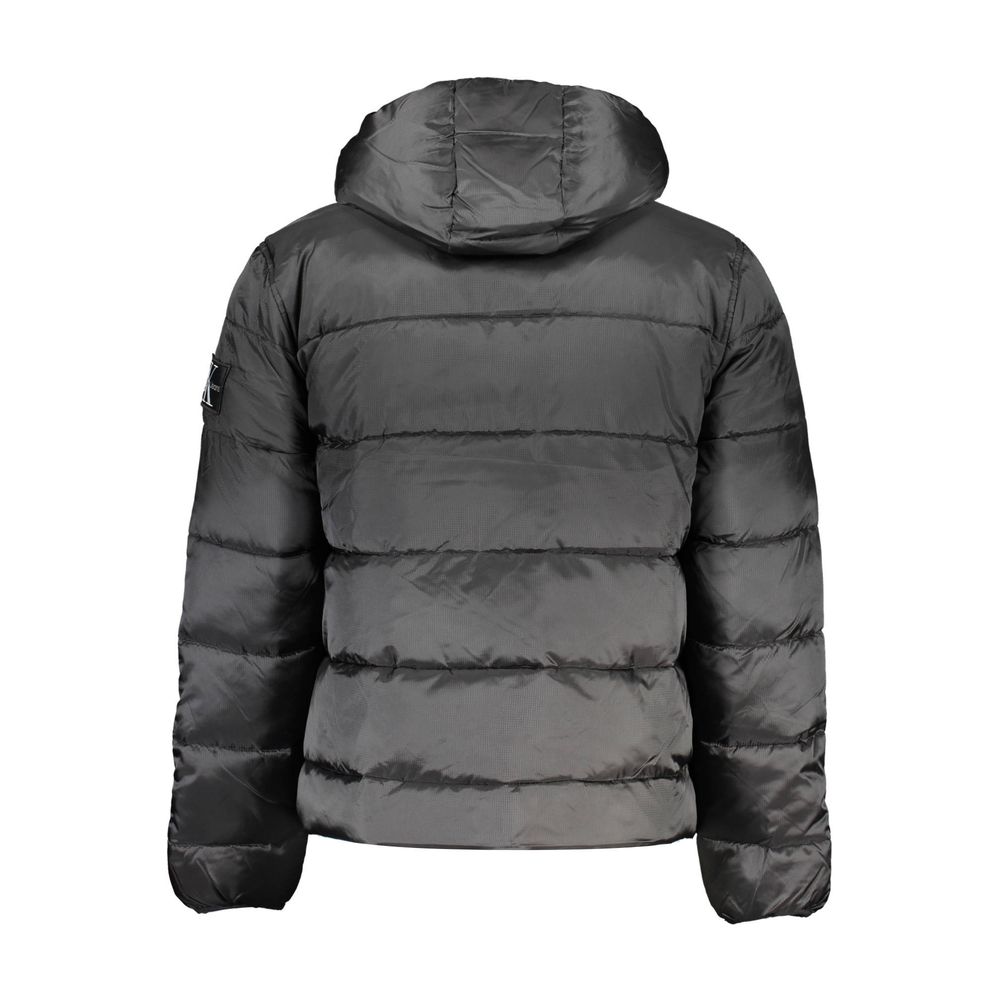 Black Polyester Men JacketIndulge in the epitome of modern style with the Calvin Klein jacket, a true testament to eco-conscious fashion with its 100% recycled polyester build. Perfect for those crisp, cool days, its long sleeves and protective hood make