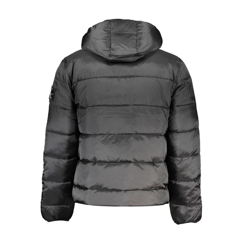 Black Polyester Men JacketIndulge in the epitome of modern style with the Calvin Klein jacket, a true testament to eco-conscious fashion with its 100% recycled polyester build. Perfect for those crisp, cool days, its long sleeves and protective hood make