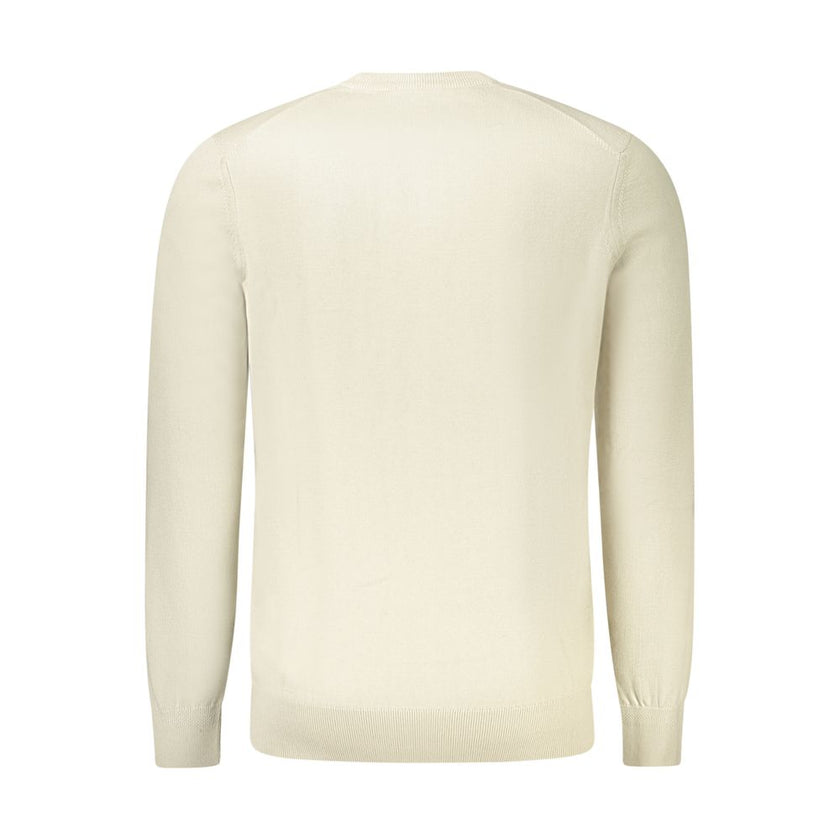 Beige Cotton Men SweaterIndulge in the supreme comfort and undeniable style of the Hugo Boss Long Sleeved T-Shirt. Crafted with a luxurious blend of 95% cotton and 5% cashmere, this beige crew neck staple is accentuated with a sleek application logo, ensu