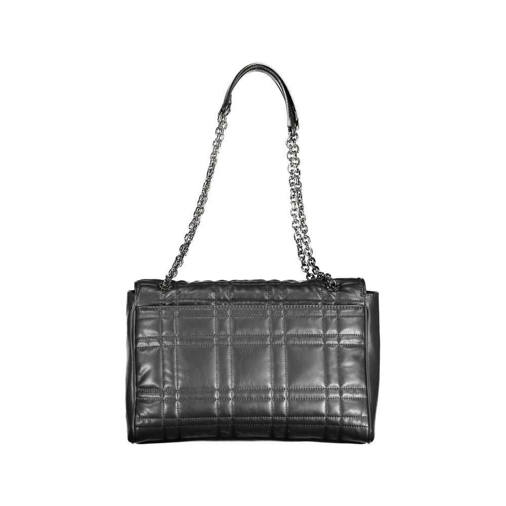 Black Polyester Women HandbagElevate your accessory game with the eco-conscious chic of this Calvin Klein handbag. Effortlessly versatile, it boasts a sleek black hue with contrasting details that add a pop of sophistication. Two chain handles provide a g