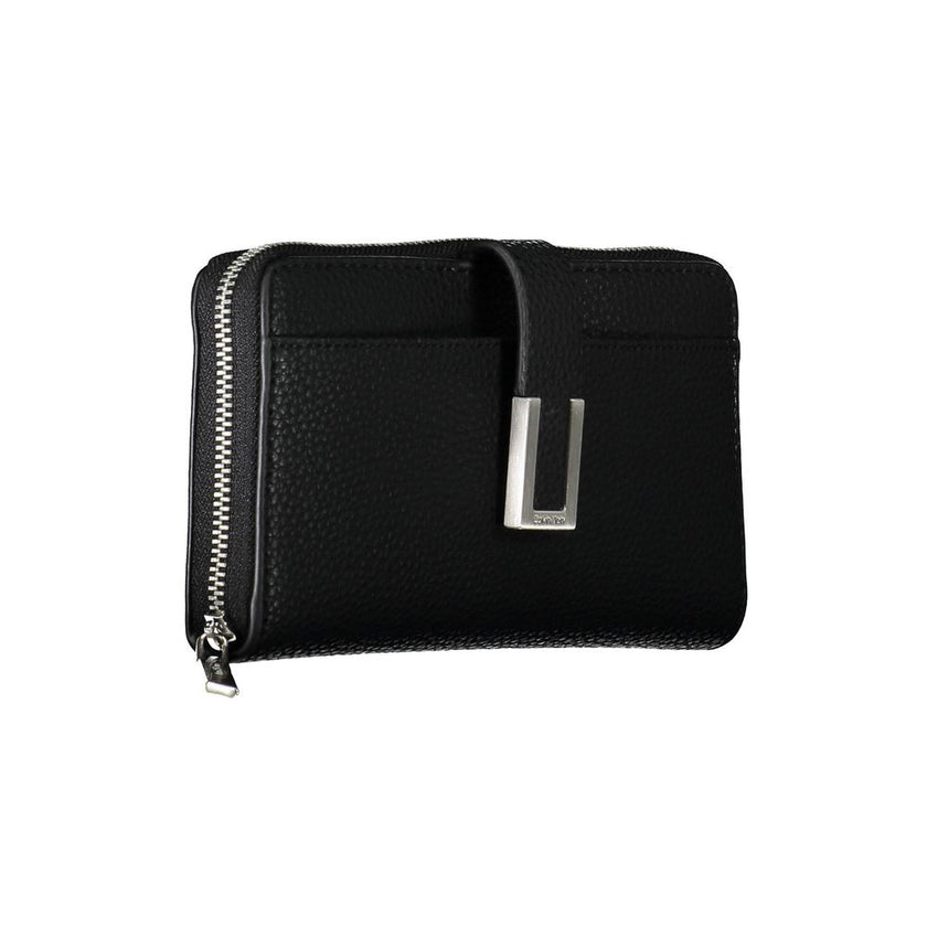 Black Polyester Women WalletElevate your accessory game with this sleek and sophisticated Calvin Klein wallet. Crafted for the modern women who appreciates minimalist elegance and functionality. With five compartments, a coin purse, and double card slots,
