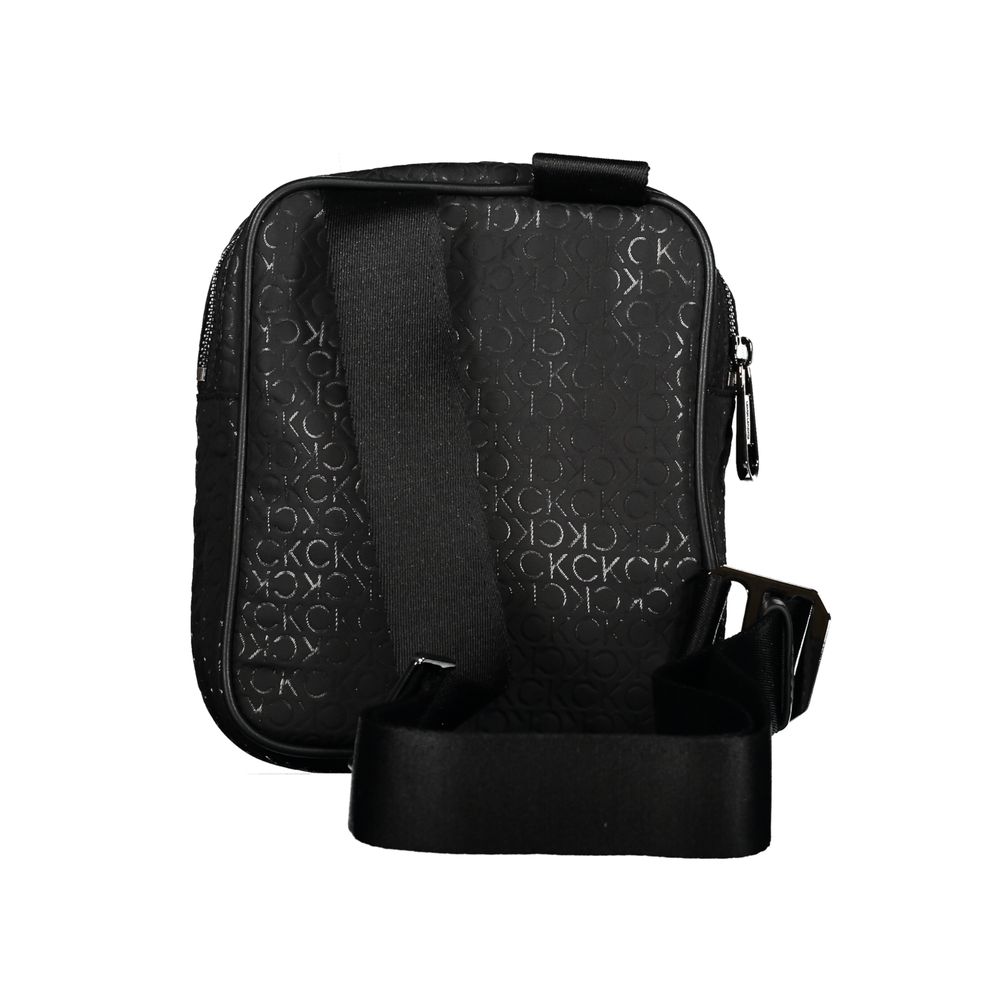 Sleek Urban Shoulder Bag with Contrast DetailsStep out in style with this sleek Calvin Klein shoulder bag, perfect for the modern man on-the-go. Its adjustable shoulder strap allows for comfortable wear while the contrasting details add a touch of sophist