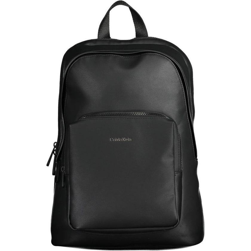 Black Polyester Men BackpackElevate your on-the-go style with the Calvin Klein Essential Backpack, a blend of functionality and eco-friendly fashion. Crafted with 50% recycled materials, this sleek black accessory is a testament to modern design and susta