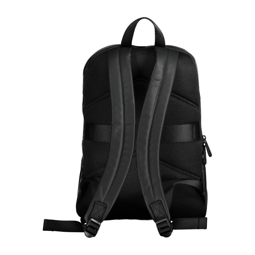 Black Polyester Men BackpackElevate your on-the-go style with the Calvin Klein Essential Backpack, a blend of functionality and eco-friendly fashion. Crafted with 50% recycled materials, this sleek black accessory is a testament to modern design and susta