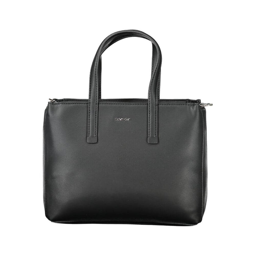 Black Polyester Women HandbagUnleash the epitome of urban-chic with the Calvin Klein masterpiece that seamlessly blends sustainability with style. Imagine the touch of sophistication with a bag that boasts dual handles for sheer elegance, a versatile adju