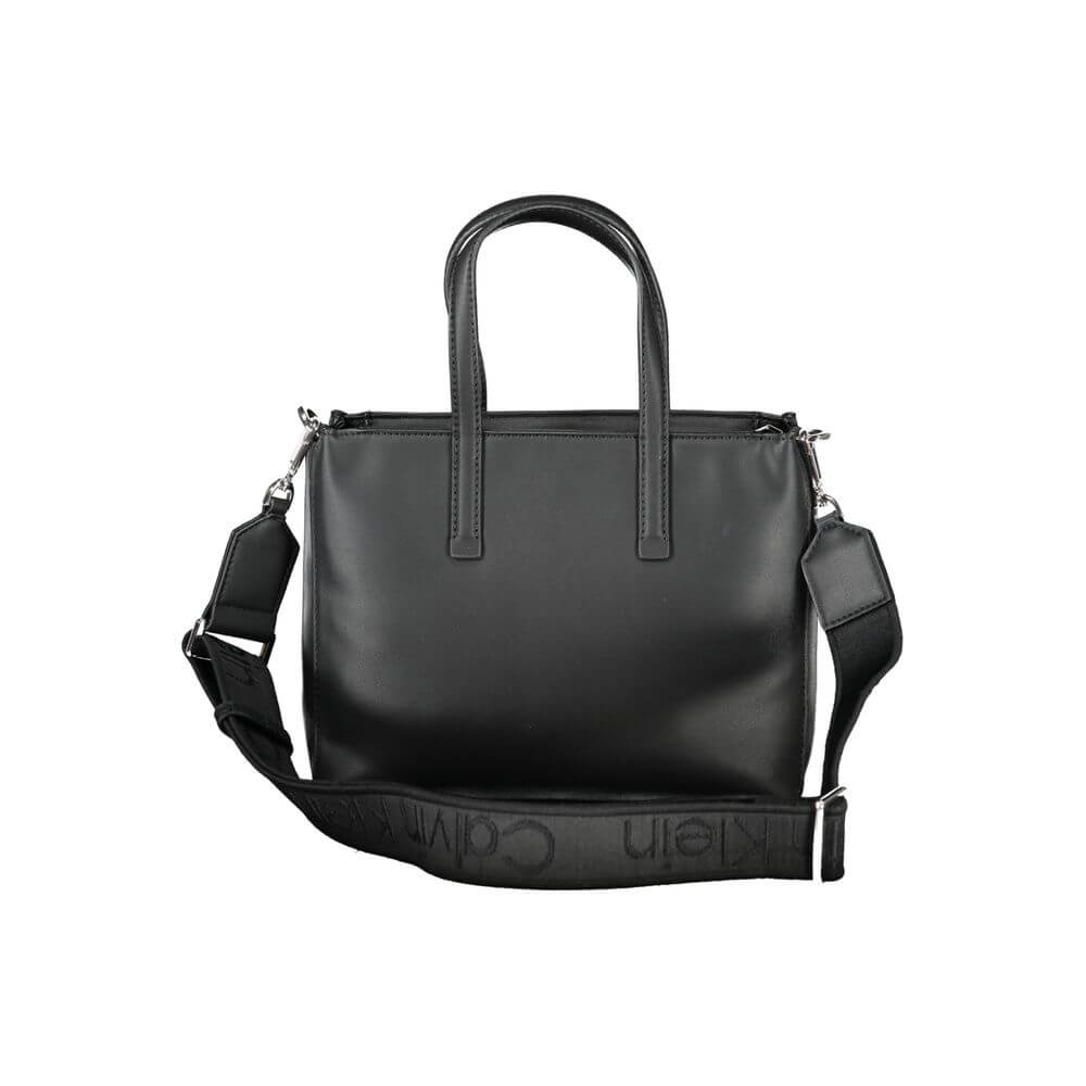 Black Polyester Women HandbagUnleash the epitome of urban-chic with the Calvin Klein masterpiece that seamlessly blends sustainability with style. Imagine the touch of sophistication with a bag that boasts dual handles for sheer elegance, a versatile adju