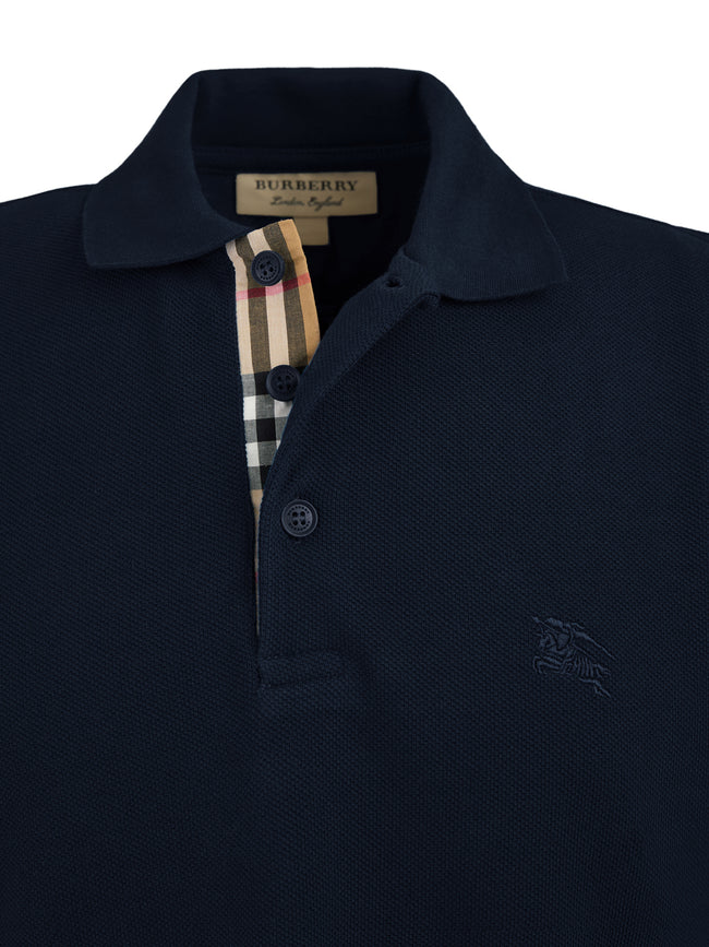 Navy Blue Cotton Collared Polo ShirtBURBERRY Gorgeous brand new, Navy blue Cotton Collared Polo Shirt Art#: 8014004 Model: Short sleeve Polo Shirt Colour: Navy Blue Material: 100% Cotton Fitting: Regular Fit Logo details Made in ThailandNavy Blue Cotton C