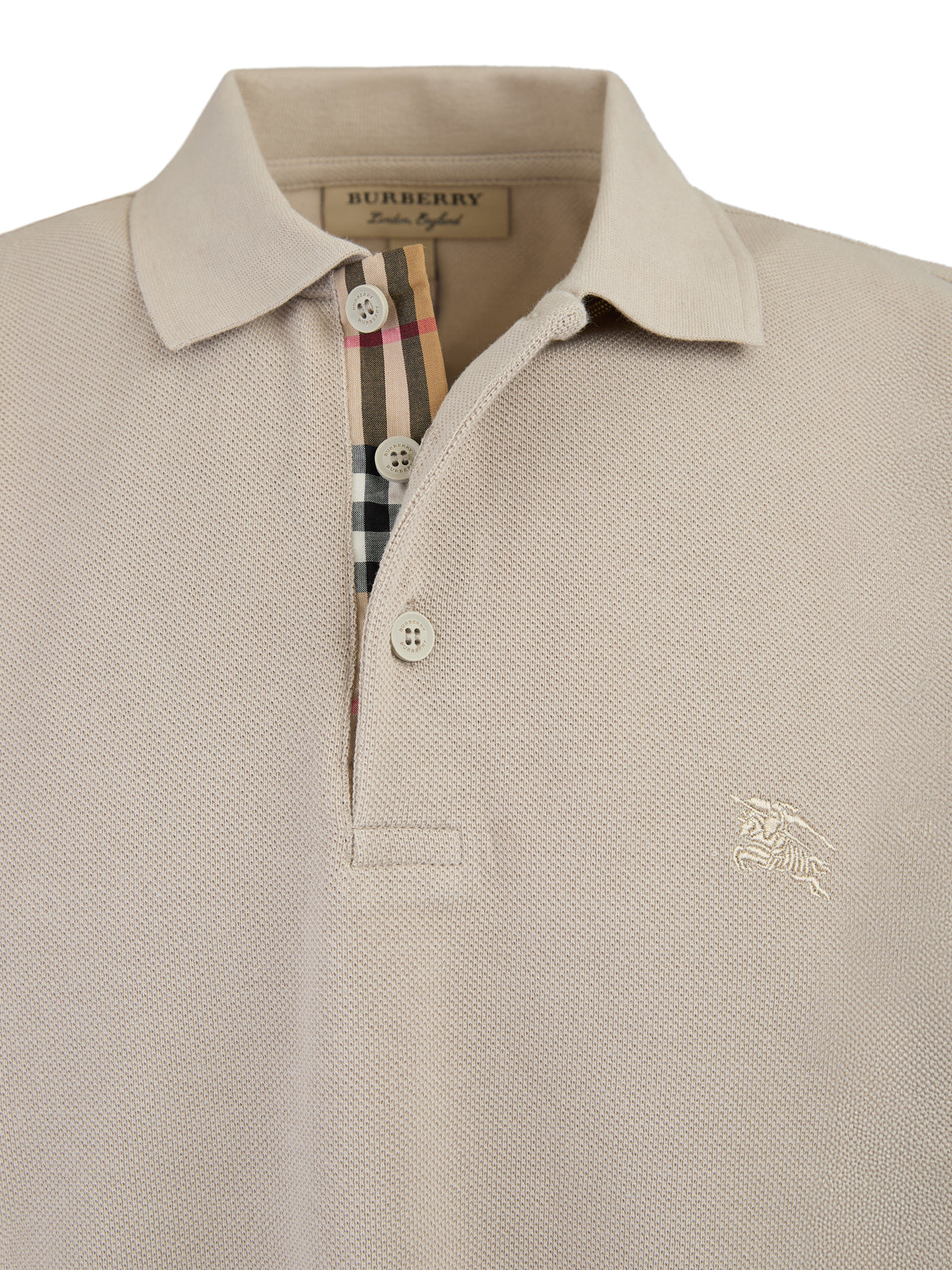 Pale Stone Cotton Collared Polo ShirtBURBERRY Gorgeous brand new, Pale StoneCotton Collared Polo Shirt Art#: 4005899 Model: Short sleeve Polo Shirt Colour: Pale Stone Material: 100% Cotton Fitting: Regular Fit Logo details Made in ThailandPale Stone Cotto
