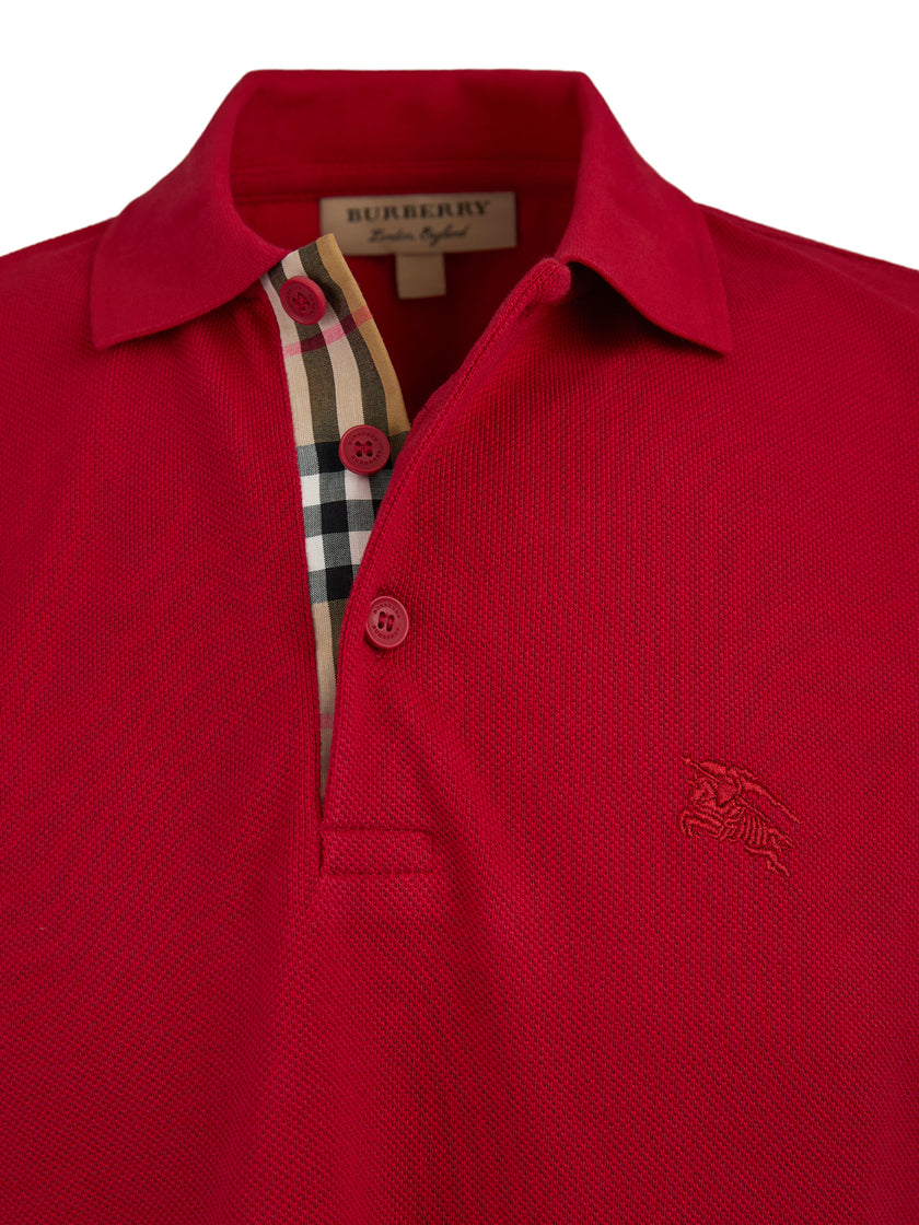 Red Cotton Collared Polo ShirtBURBERRY Gorgeous brand new, Red Cotton Collared Polo Shirt Art#: 8003122 Model: Short sleeve Polo Shirt Colour: Red Material: 100% Cotton Fitting: Regular Fit Logo details Made in ThailandRed Cotton Collared Polo Shirt${tags