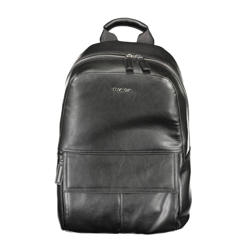 Black Polyester Men BackpackElevate your on-the-go style with the Calvin Klein Backpack, designed for the modern urban explorer. Featuring a sleek black exterior, this backpack is crafted with practicality and superior design in mind. The one handle and c