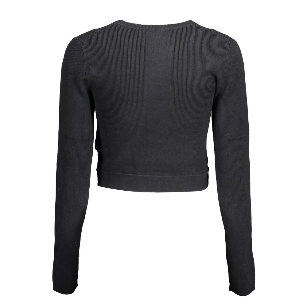 Black Lyocell Women SweaterElevate your wardrobe with the epitome of sleek sophistication: the Calvin Klein long-sleeved shirt. Meticulously crafted with a blend of elastane, lyocell, and polyamide, this piece offers a luxurious feel with just the right a
