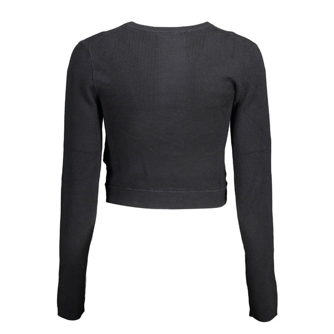 Black Lyocell Women SweaterElevate your wardrobe with the epitome of sleek sophistication: the Calvin Klein long-sleeved shirt. Meticulously crafted with a blend of elastane, lyocell, and polyamide, this piece offers a luxurious feel with just the right a