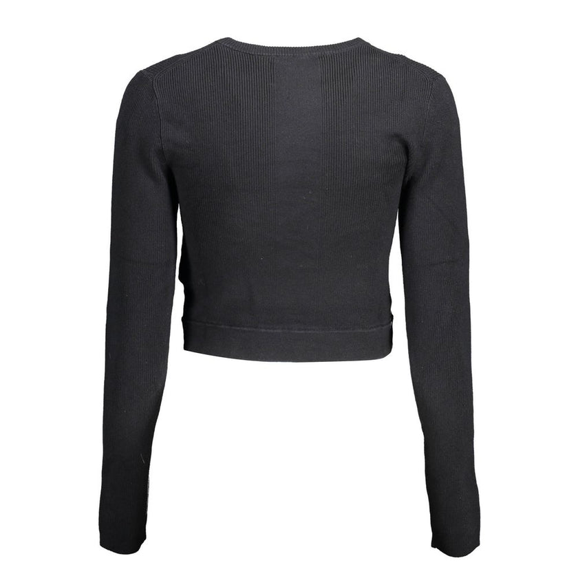 Black Lyocell Women SweaterElevate your wardrobe with the epitome of sleek sophistication: the Calvin Klein long-sleeved shirt. Meticulously crafted with a blend of elastane, lyocell, and polyamide, this piece offers a luxurious feel with just the right a