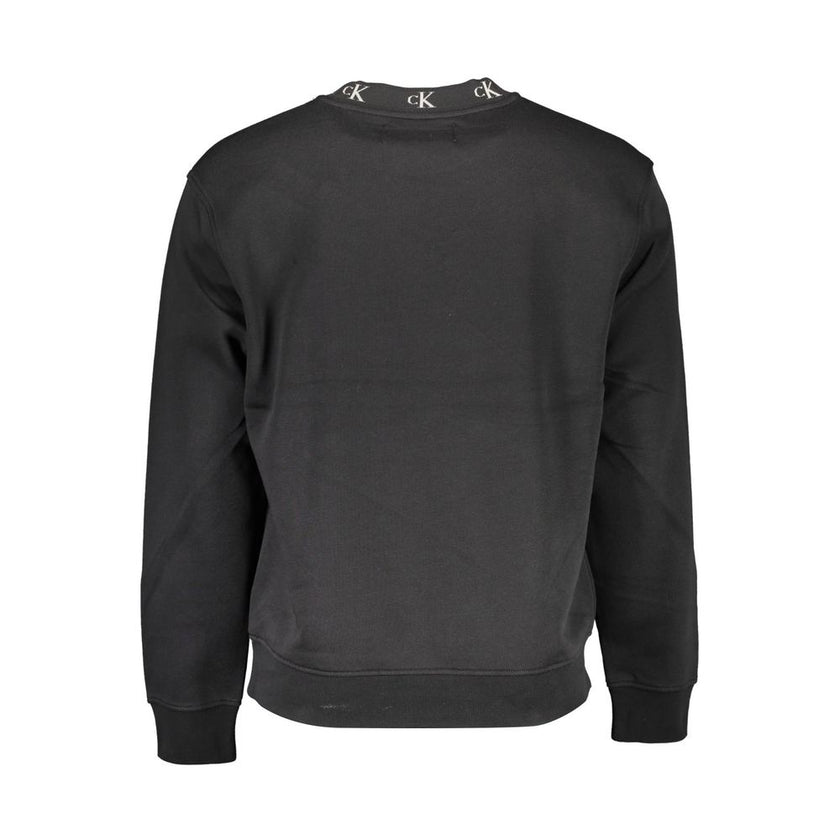 Black Cotton Men SweaterElevate your streetwear ensemble with Calvin Klein’s sleek long-sleeved sweatshirt. The crisp black hue is punctuated by contrasting details that exude a modern vibe, while the prominent logo placement is a nod to the brand’s iconi